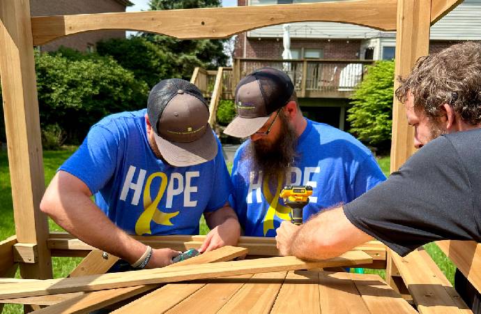 Roc Solid Playset Build with Volunteers and a Little Superhero
