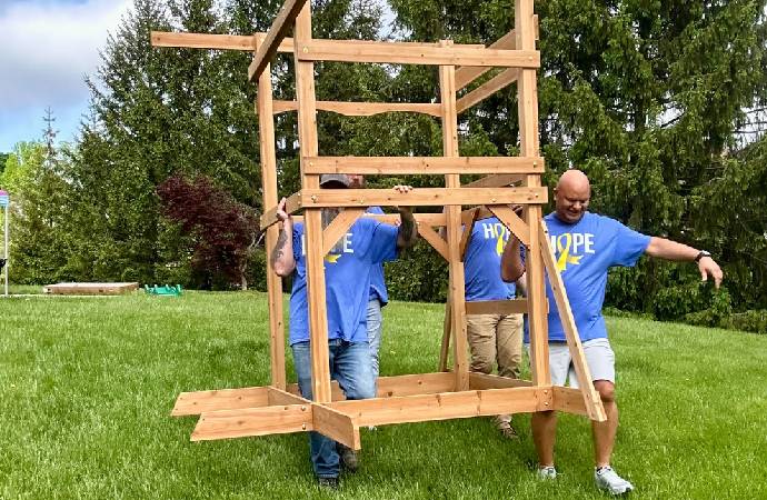 Roc Solid Playset Build with Volunteers and a Little Superhero