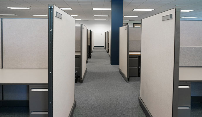 Clean row of beige office cubicles