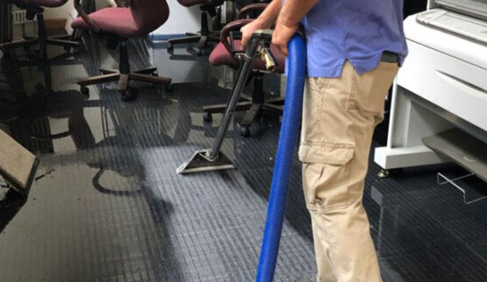 Water damaged carpet restoration service
