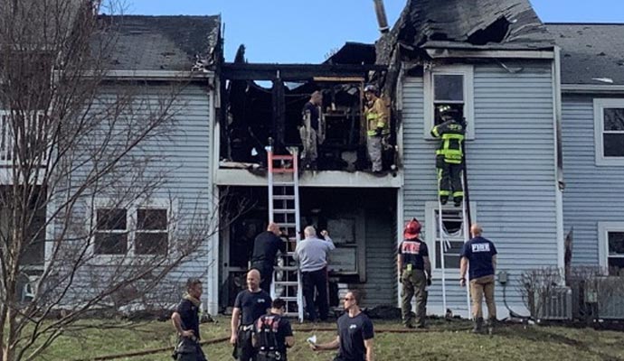 a team performing fire damage restoration service in a fire
          damaged house