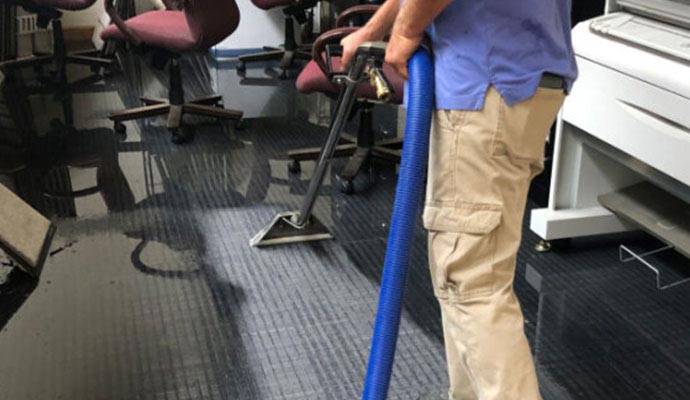 Water damaged carpet restoration service
