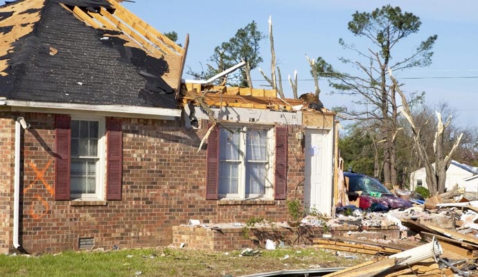 A house with severe structural damage caused by a disaster